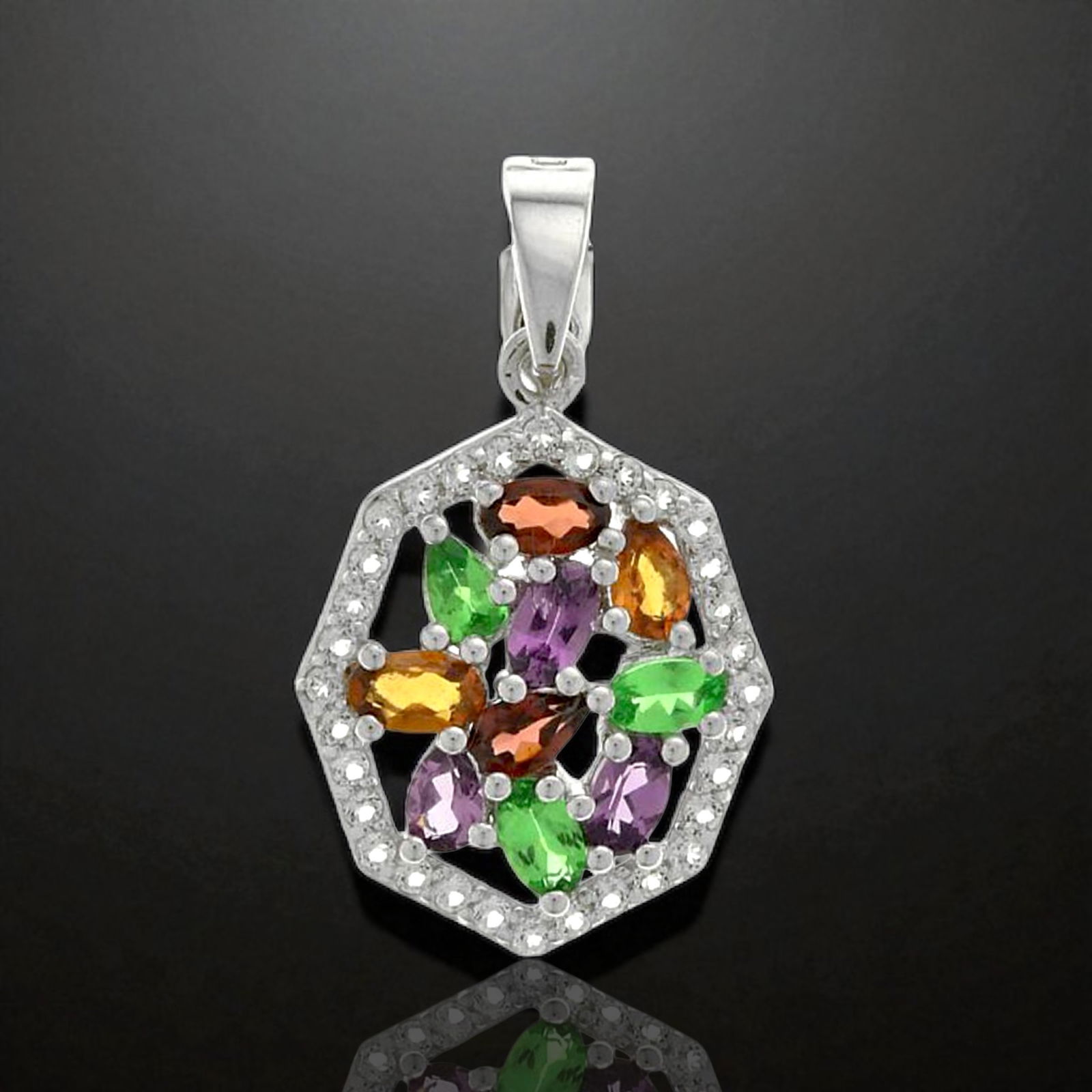 Splendid Sterling Silver Multi-Garnet & White Topaz Pendant: Product Details Item: Pendant Metal: Sterling Silver Gemstone: White Topaz, Mozambique Garnet, Hessonite Garnet, Purple&Green Garnet Approximate Measurements: 32 mm X 18.6 mm Ring Size: Not Applicable