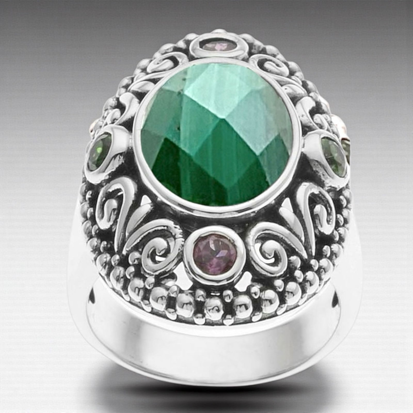 Bali design Malachite Sterling Silver Ring with Gemstones-Sz 7: Malachite (1) 13 mm X 10 mm Rhoddolite Garnet (2) 3 mm Chrome Diopside (2) 3 mm Product Details Item: Ring Metal: Sterling Silver Gemstone: Malachite, Rhodolite Garnet, & Chrome Diopside Approximate M