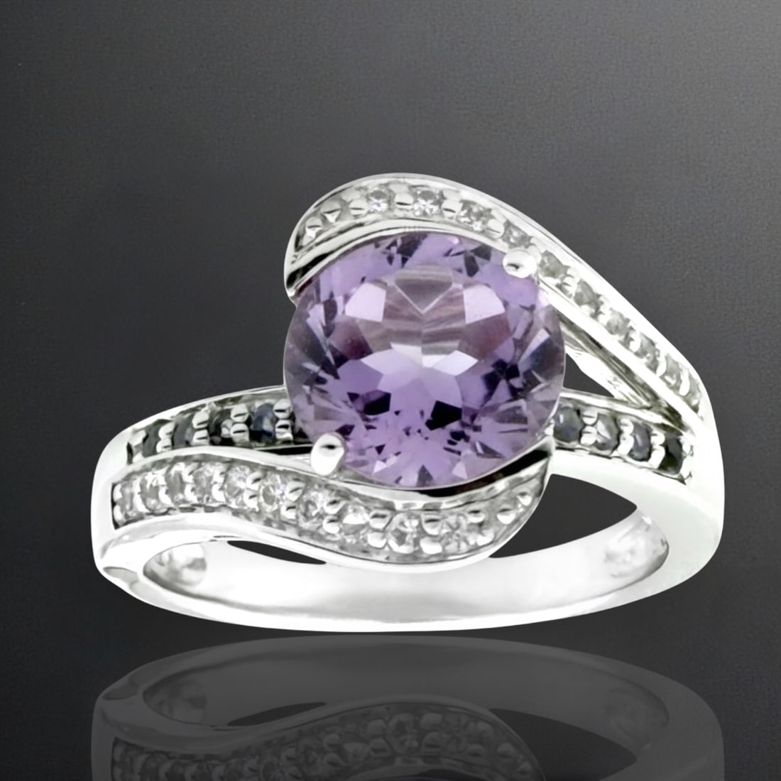 Amethyst, Iolite, & White Topaz Sterling Silver Ring - Size 7: Product Details Item: Ring Metal: Sterling Silver Gemstone: Amethyst, Iolite, & White Topaz Approximate Measurements: Width: 13.7mm Ring Size: 7 Chain Length: Not Applicable Chain Metal: N