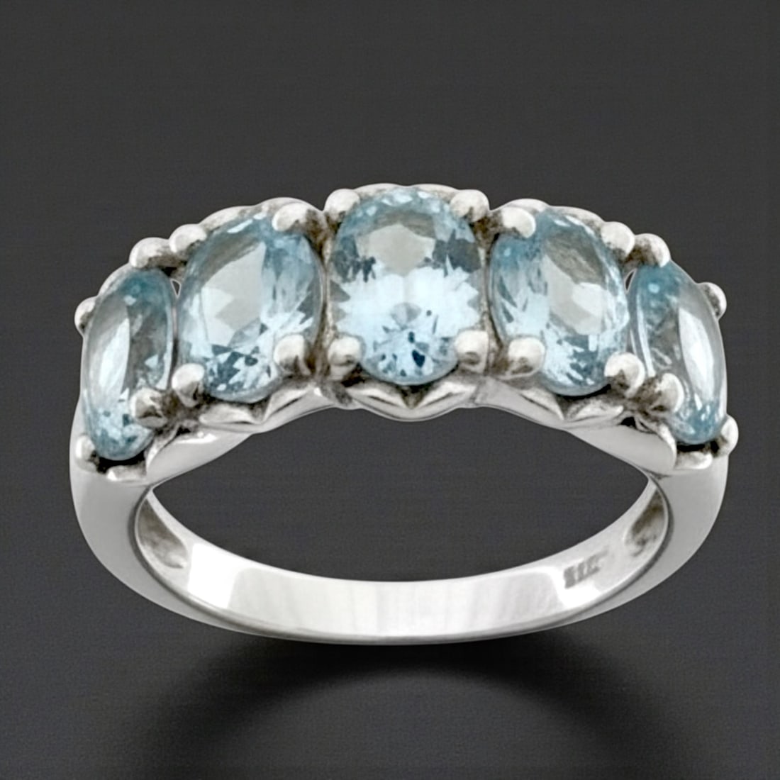 Oval Blue Topaz 5-Gemstone Sterling Silver Ring - Size 8: Product Details Item: Ring Metal: Sterling Silver Gemstone: Blue Topaz Approximate Measurements: Width: 8.7 mm Ring Size: 8 Chain Length: Not Applicable Chain Metal: Not Applicable