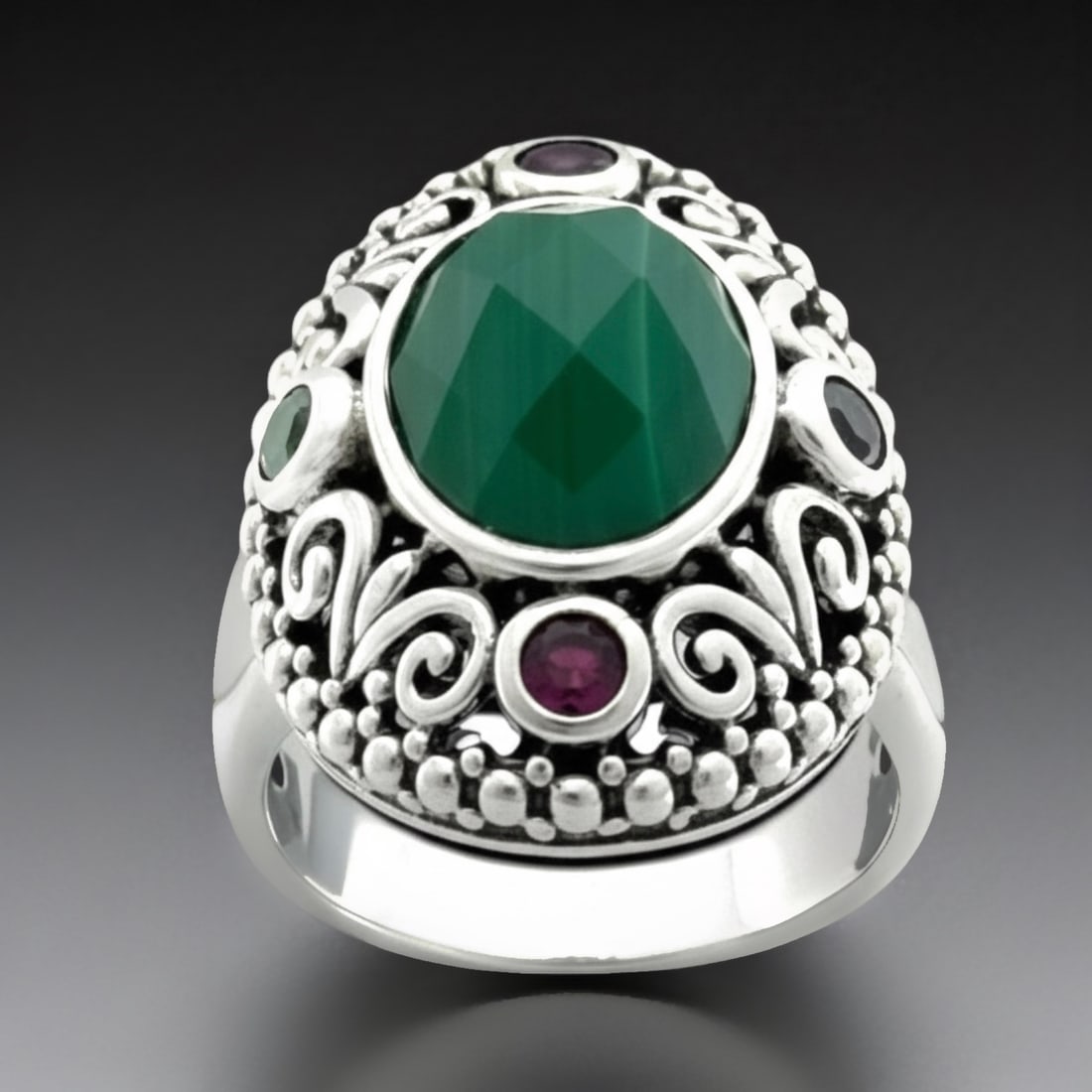 Bali design Malachite Sterling Silver Ring with Gemstones-Sz 8: Malachite (1) 13 mm X 10 mm Rhoddolite Garnet (2) 3 mm Chrome Diopside (2) 3 mm Product Details Item: Ring Metal: Sterling Silver Gemstone: Malachite, Rhodolite Garnet, & Chrome Diopside Approximate M