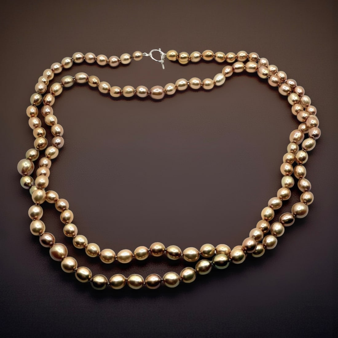 Genuine Golden Champagne Freshwater Pearl 39" Necklace: Product Details Item: Necklace Metal: Not Applicable Gemstone: Freshwater Pearl Approximate Measurements: Appx Width:6.5-7.5 mm Ring Size: Not Applicable Chain Length: Not Applicable Cha