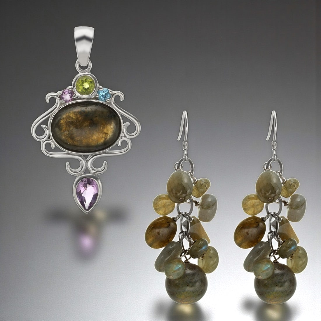 Labradorite Multi Gemstone Pendant and Earrings Combo Set: Product Details Item: Earrings & Pendant Metal: Sterling Silver Gemstone: Labradorite, Amethyst, Blue Topaz, & Peridot Approximate Measurements: Pendant:49.7 mm X 28.6mm Earrings: Appx 54 mm X 18 mm)