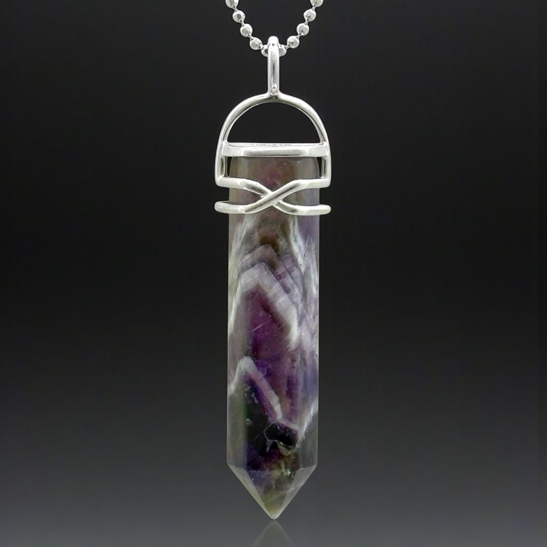 Sterling Silver large Banded Amethyst Hex Point Pendant With 18": Product Details Item: Necklace Metal: Sterling Silver Gemstone: Amethyst Approximate Measurements: 59.6 mm X 10 mm Ring Size: Not Applicable Chain Length: 18" Chain Metal: Sterling Silve