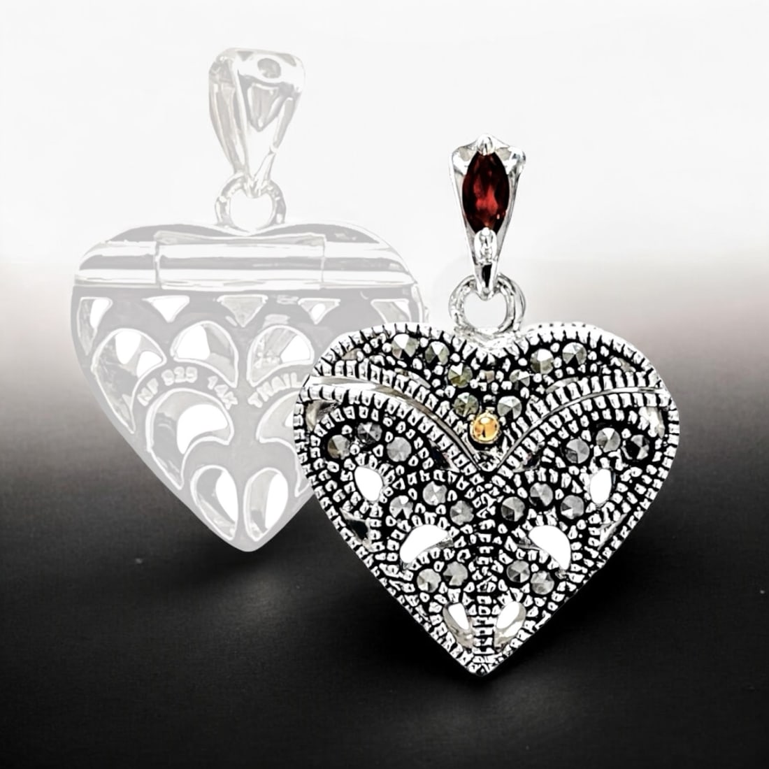 14K Gold & Sterling Silver Marcasite Heart Locket Pendant: Product Details Item: Locket Metal: 14K Gold & Sterling Silver Gemstone: Garnet & Marcasite Approximate Measurements: 27.4 mm X 19.8 mm Ring Size: Not Applicable Chain Length: Not Applicable <