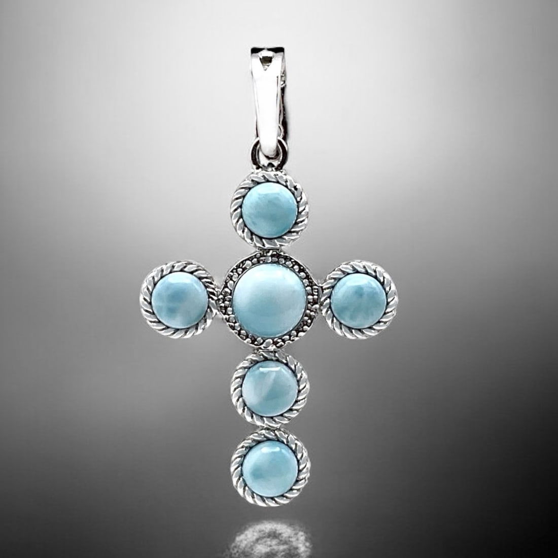 Cable Design Blue Larimar Sterling Silver Cross Pendant: Product Details Item: Pendant Metal: Sterling Silver Gemstone: Larimar Approximate Measurements: 50 mm X 27.9 mm Ring Size: Not Applicable Chain Length: Not Applicable Chain Metal: Not Ap
