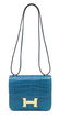 A SHINY BLEU IZMIR ALLIGATOR MINI CONSTANCE 18 WITH