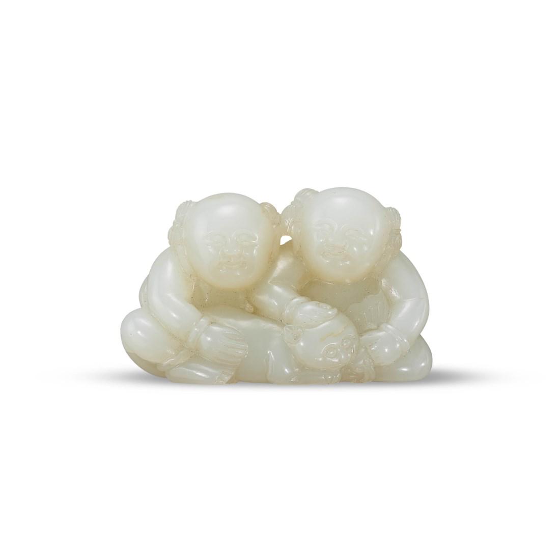 A CARVED WHITE JADE ‘BOYS AND LONGEVITY’ GROUP