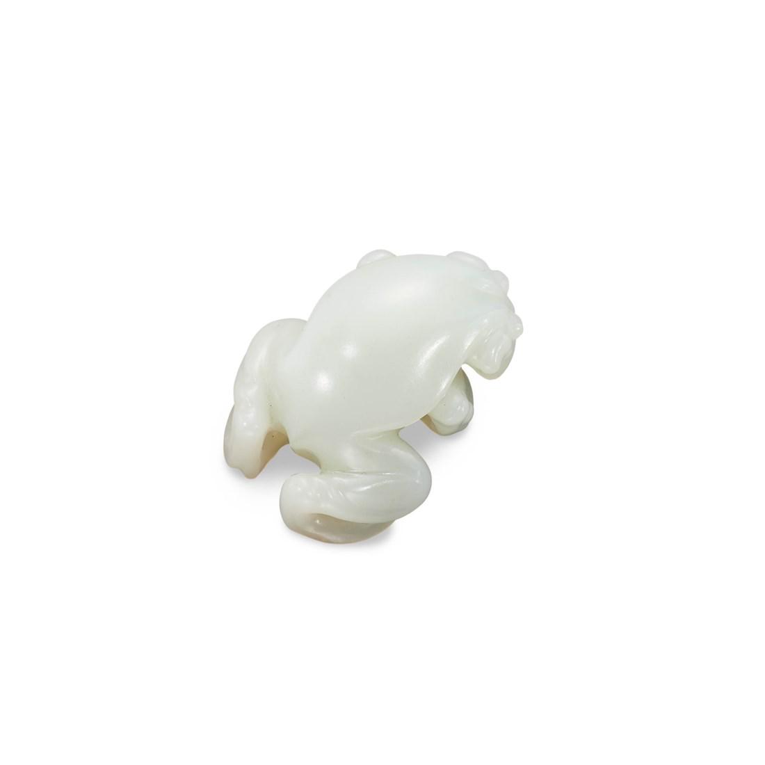 A CARVED WHITE JADE TOAD