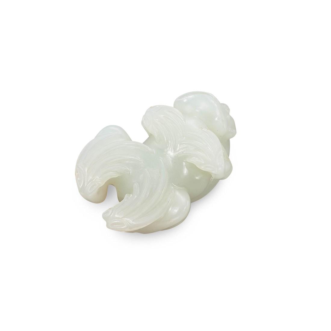 A CARVED WHITE JADE TOAD