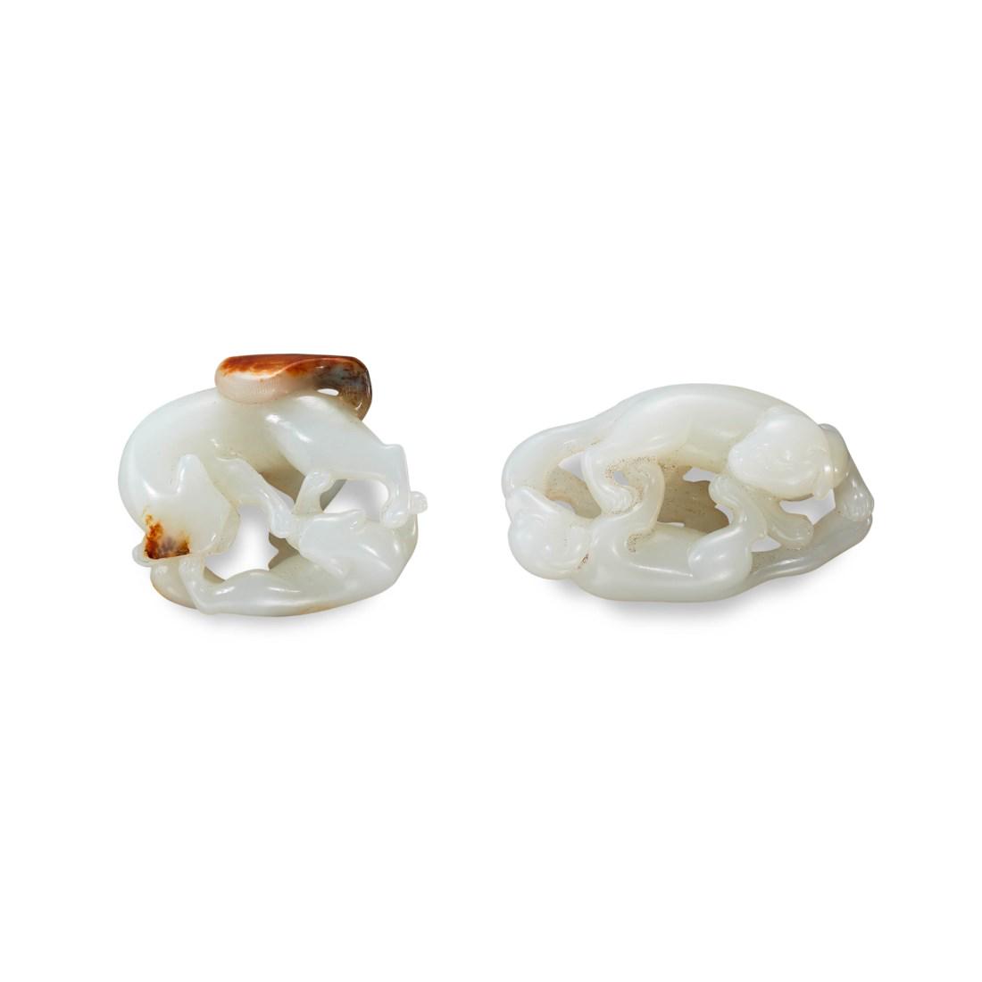 TWO CARVED WHITE JADE ‘TWIN-BADGER’ TOGGLES