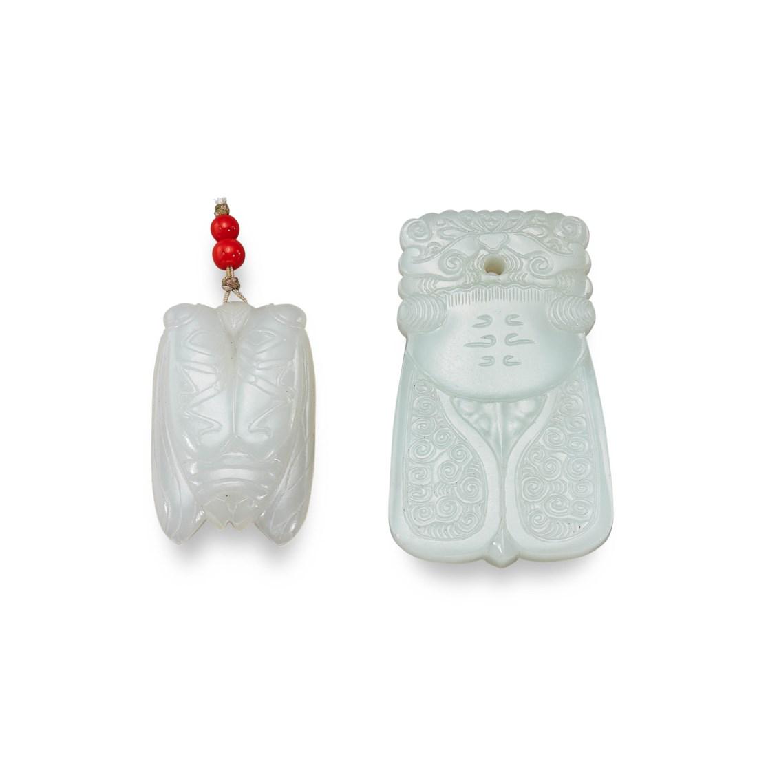 TWO CARVED WHITE JADE ‘CICADA’ PENDANTS