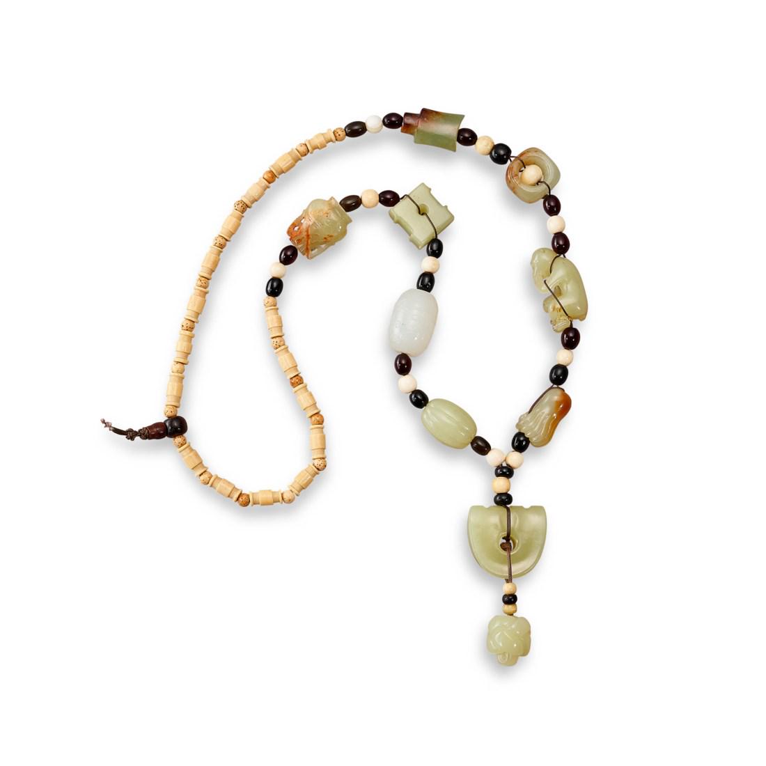 A YELLOW AND WHITE JADE AND BONE NECKLACE