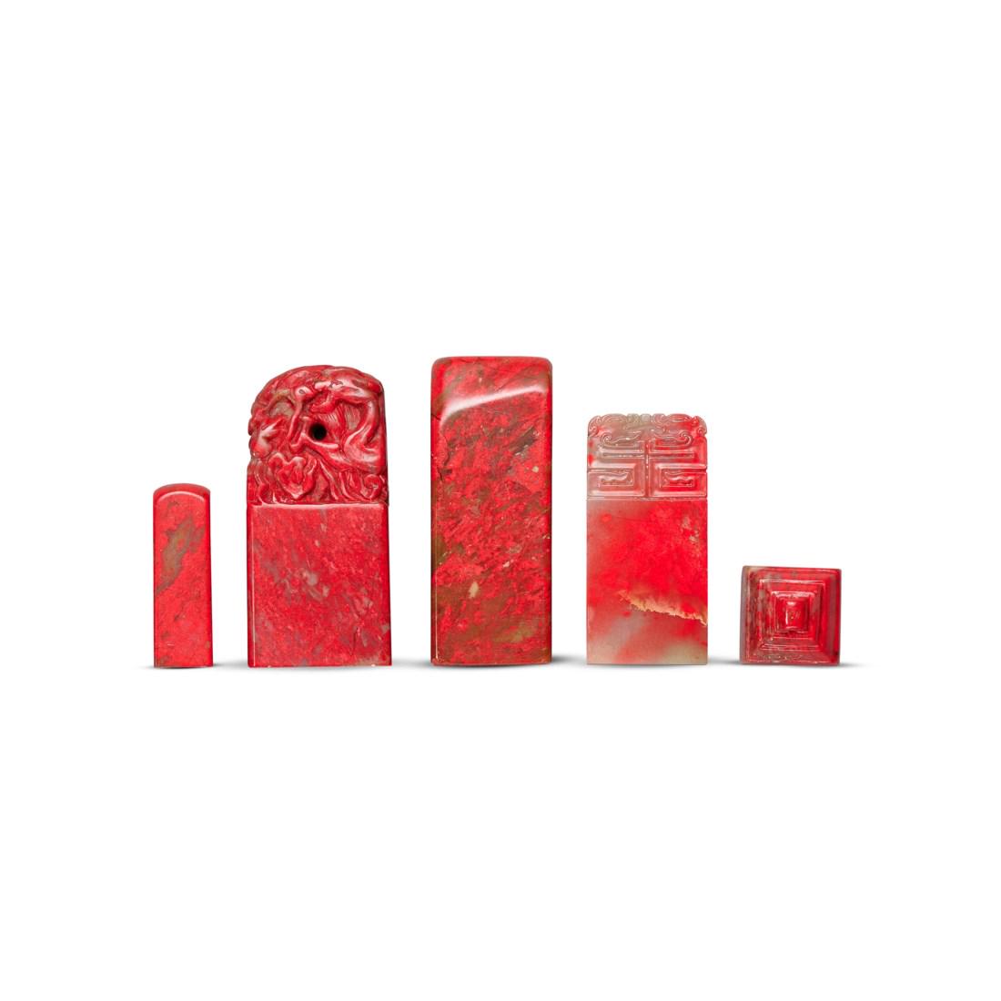 A GROUP OF TEN ‘CHICKEN BLOOD’ SOAPSTONE SEALS