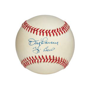 DON LARSEN AND YOGI BERRA AUTOGRAPHED BASEBALL (JSA): DON LARSEN AND YOGI BERRA AUTOGRAPHED BASEBALL (JSA) Lot Essay B.Brown American League baseball signed by the 1956 World Series perfect game battery mates in blue ink rating 8 out of 10. Includes COA