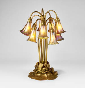 TIFFANY STUDIOS: TEN-LIGHT ‘LILY’ TABLE LAMP, CIRCA 1915 TIFFANY STUDIOS Ten-Light ‘Lily’ Table Lamp, circa 1915 Favrile glass, gilt bronze 20 ¾ in. (52.8 cm) high, 11 in. (28 cm) diameter