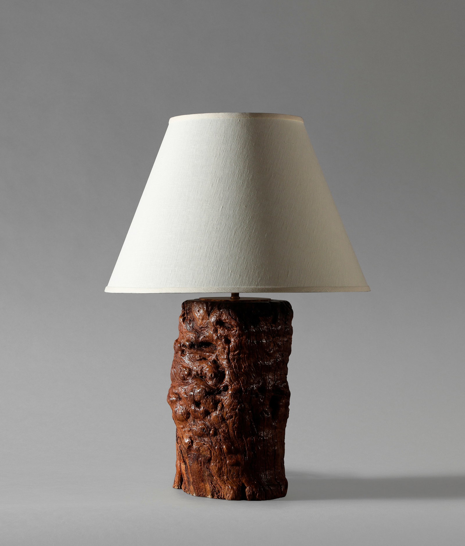 A CHINESE RED LACQUER CONSOLE TABLE: 18TH CENTURY Cylindrical legs on the angle, divided by angular cross stretcher, en suite with the subsequent lot 32 1/2 in. (82.6 cm.) high, 52 in. (132.1 cm.) wide, 27 1/2 in. (69.9 cm.) deep Provena