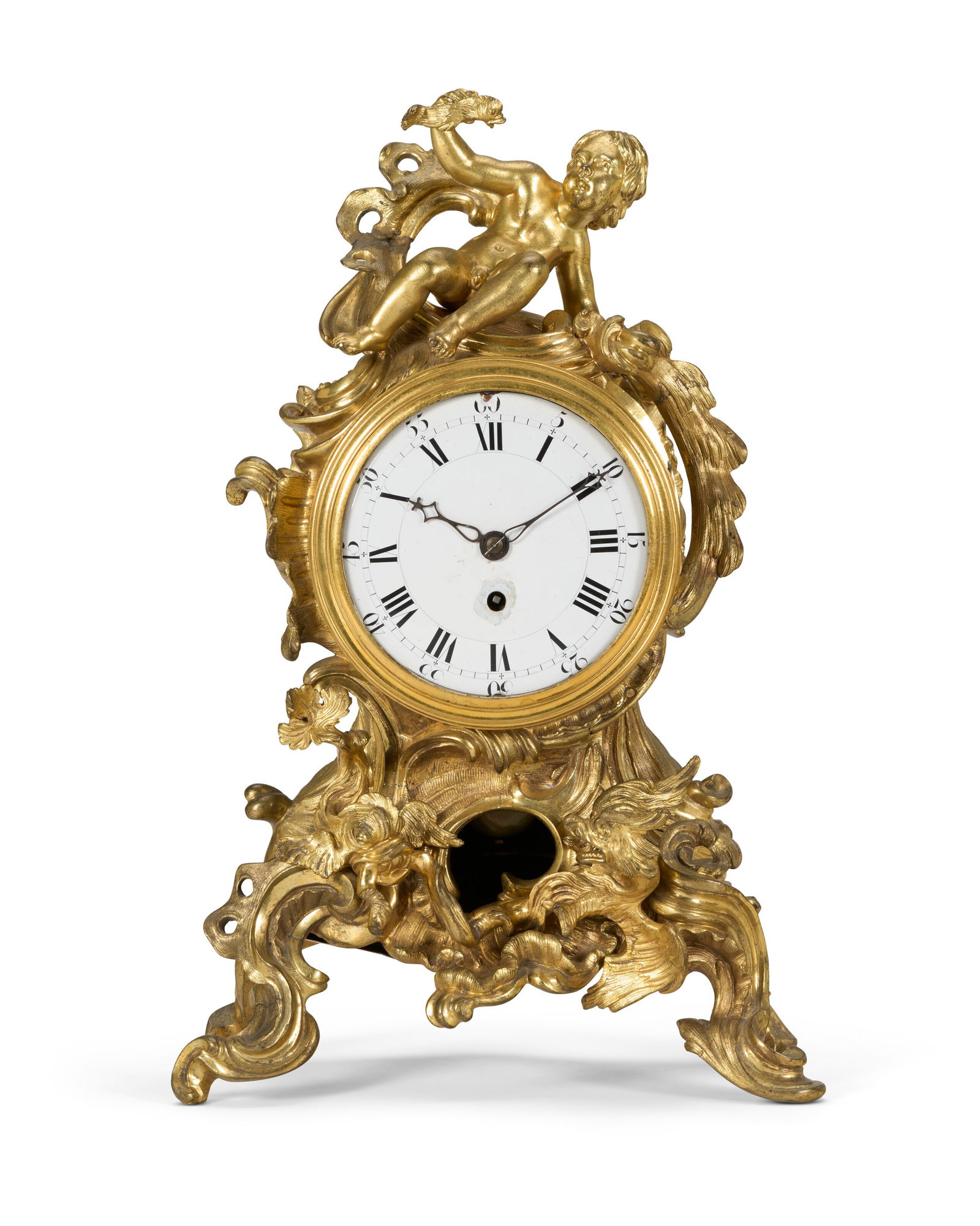 A LOUIS XV ORMOLU MANTEL CLOCK: A LOUIS XV ORMOLU MANTEL CLOCK CIRCA 1740, THE DIAL, MOVEMENT AND HANDS REPLACED Details The drum-shaped case surrounded by pierced scrolls and rocaille, surmounted by a putto holding a fish and above