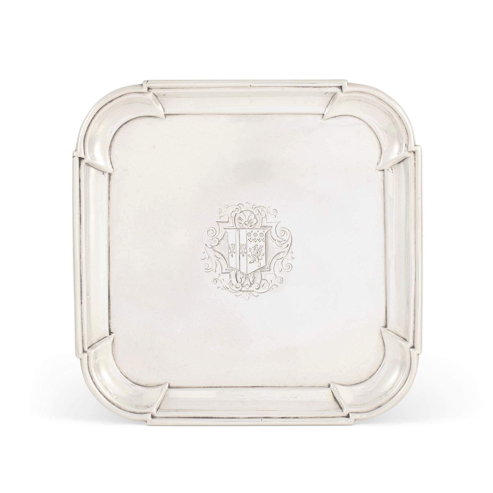 A GEORGE I SILVER WAITER: A GEORGE I SILVER WAITER MARK OF JOHN TUITE, LONDON, 1725 Details Shaped square on four bracket feet with rounded corners and moulded border, engraved in centre with a coat-of-arms, marked underneath