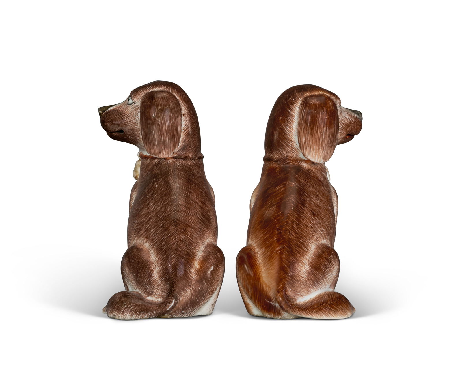 A PAIR OF CHINESE EXPORT PORCELAIN MODELS OF SEATED SPANIELS QIANLONG PERIOD (1736-1795), CIRCA 1760 - 4