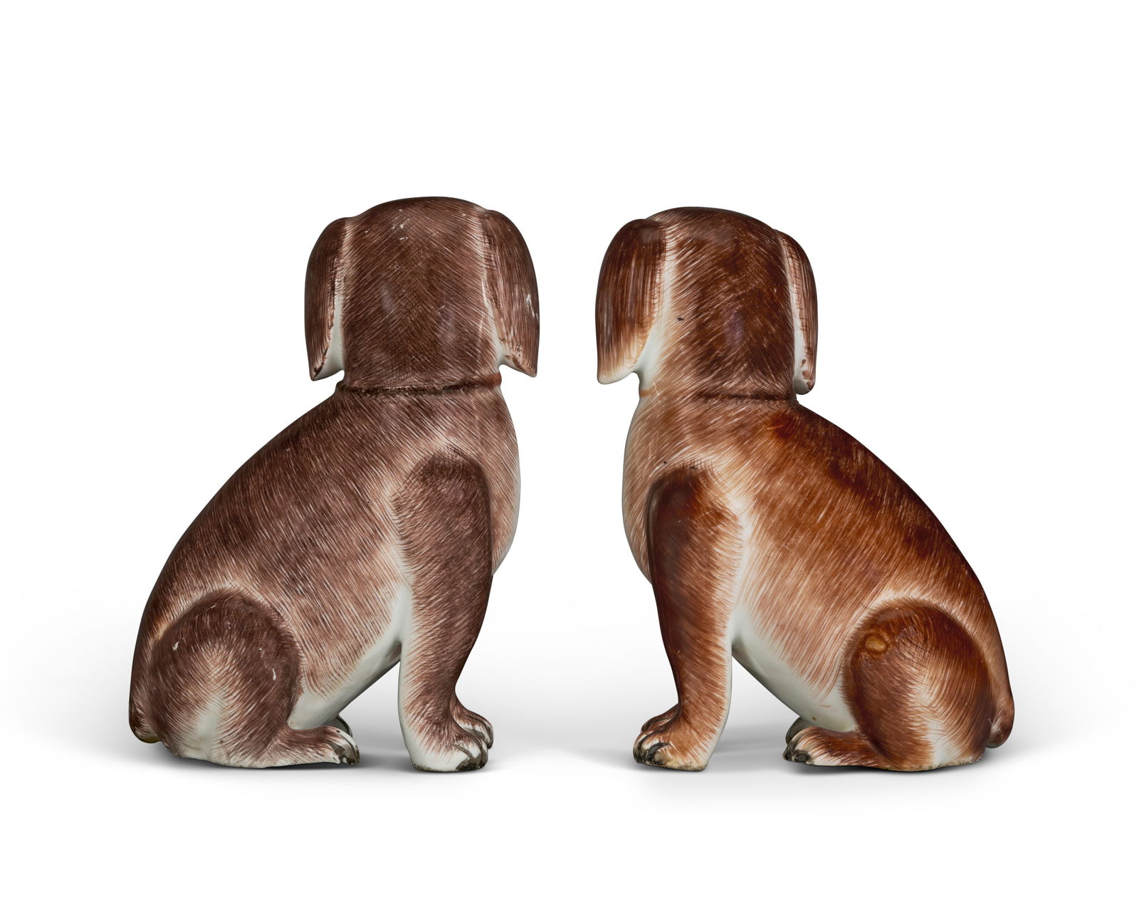 A PAIR OF CHINESE EXPORT PORCELAIN MODELS OF SEATED SPANIELS QIANLONG PERIOD (1736-1795), CIRCA 1760 - 5