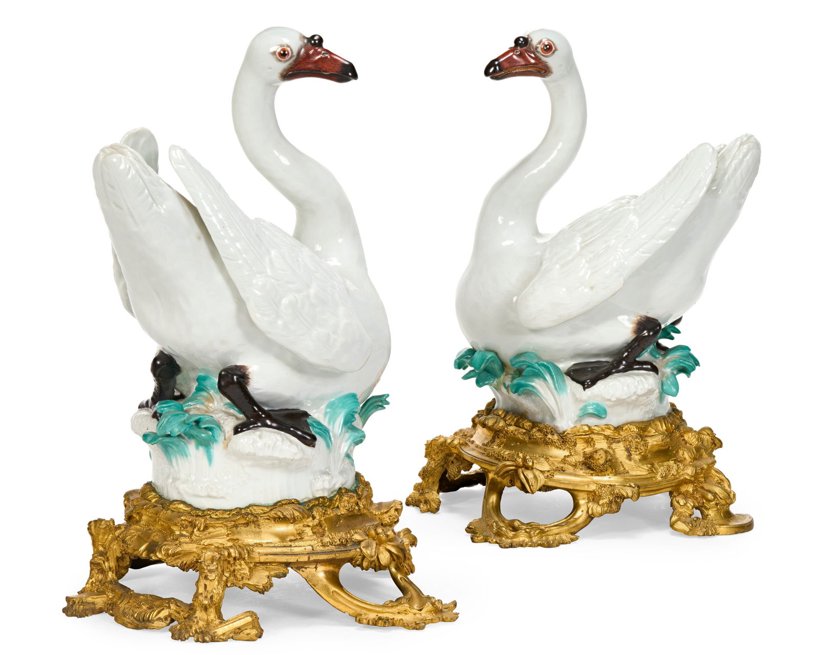 A PAIR OF ORMOLU-MOUNTED MEISSEN PORCELAIN MODELS OF SWANS THE PORCELAIN CIRCA 1748-1750, POSSIBLY: A PAIR OF ORMOLU-MOUNTED MEISSEN PORCELAIN MODELS OF SWANS THE PORCELAIN CIRCA 1748-1750, POSSIBLY MODELED BY J.J. KÄNDLER, THE DECORATION 19TH CENTURY, THE ASSOCIATED ORMOLU BASES CIRCA 1745-174