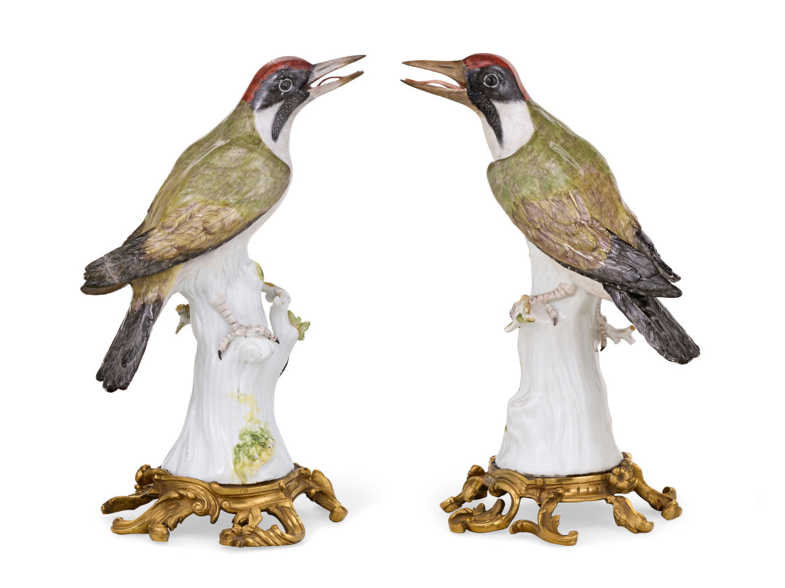 A PAIR OF ORMOLU-MOUNTED MEISSEN PORCELAIN MODELS OF GREEN WOODPECKERS THE PORCELAIN CIRCA 1760,: A PAIR OF ORMOLU-MOUNTED MEISSEN PORCELAIN MODELS OF GREEN WOODPECKERS THE PORCELAIN CIRCA 1760, BLUE CROSSED SWORDS MARK, THE ORMOLU MOUNTS OF A LATER DATE Details A PAIR OF ORMOLU-MOUNTED MEISSEN PO
