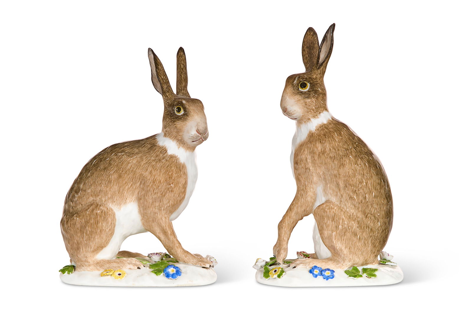 A PAIR OF MEISSEN PORCELAIN MODELS OF SEATED HARES THE PORCELAIN MID-18TH CENTURY, THE DECORATION OF: A PAIR OF MEISSEN PORCELAIN MODELS OF SEATED HARES THE PORCELAIN MID-18TH CENTURY, THE DECORATION OF LATER DATE, BLUE CROSSED SWORDS MARKS Details A PAIR OF MEISSEN PORCELAIN MODELS OF SEATED HARES 