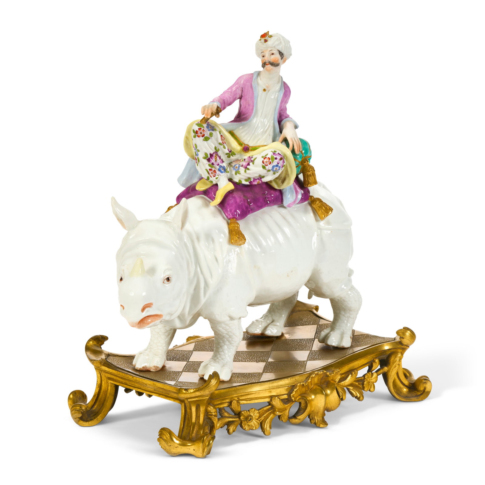 A MEISSEN PORCELAIN FIGURE GROUP OF A TURK RIDING A RHINOCEROS AND AN ORMOLU BASE THE PORCELAIN 19TH: A MEISSEN PORCELAIN FIGURE GROUP OF A TURK RIDING A RHINOCEROS AND AN ORMOLU BASE THE PORCELAIN 19TH CENTURY, SMALL PARTIAL BLUE CROSSED SWORDS MARK TO BACK OF RHINO'S LEFT FOOT, THE LOOSE ORMOLU