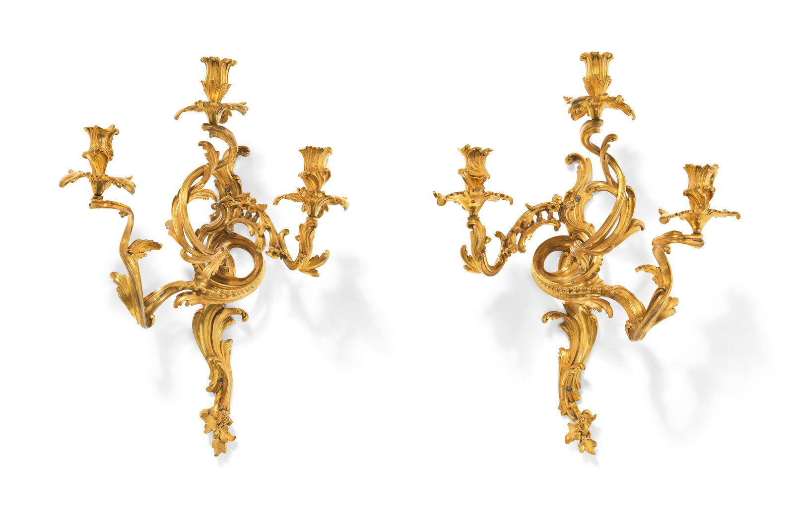 A PAIR OF EARLY LOUIS XV ORMOLU THREE-BRANCH WALL-LIGHTS ATTRIBUTED TO JACQUES CAFFIERI, CIRCA: A PAIR OF EARLY LOUIS XV ORMOLU THREE-BRANCH WALL-LIGHTS ATTRIBUTED TO JACQUES CAFFIERI, CIRCA 1735-1740 Details A PAIR OF EARLY LOUIS XV ORMOLU THREE-BRANCH WALL-LIGHTS ATTRIBUTED TO JACQUES CAFFIERI