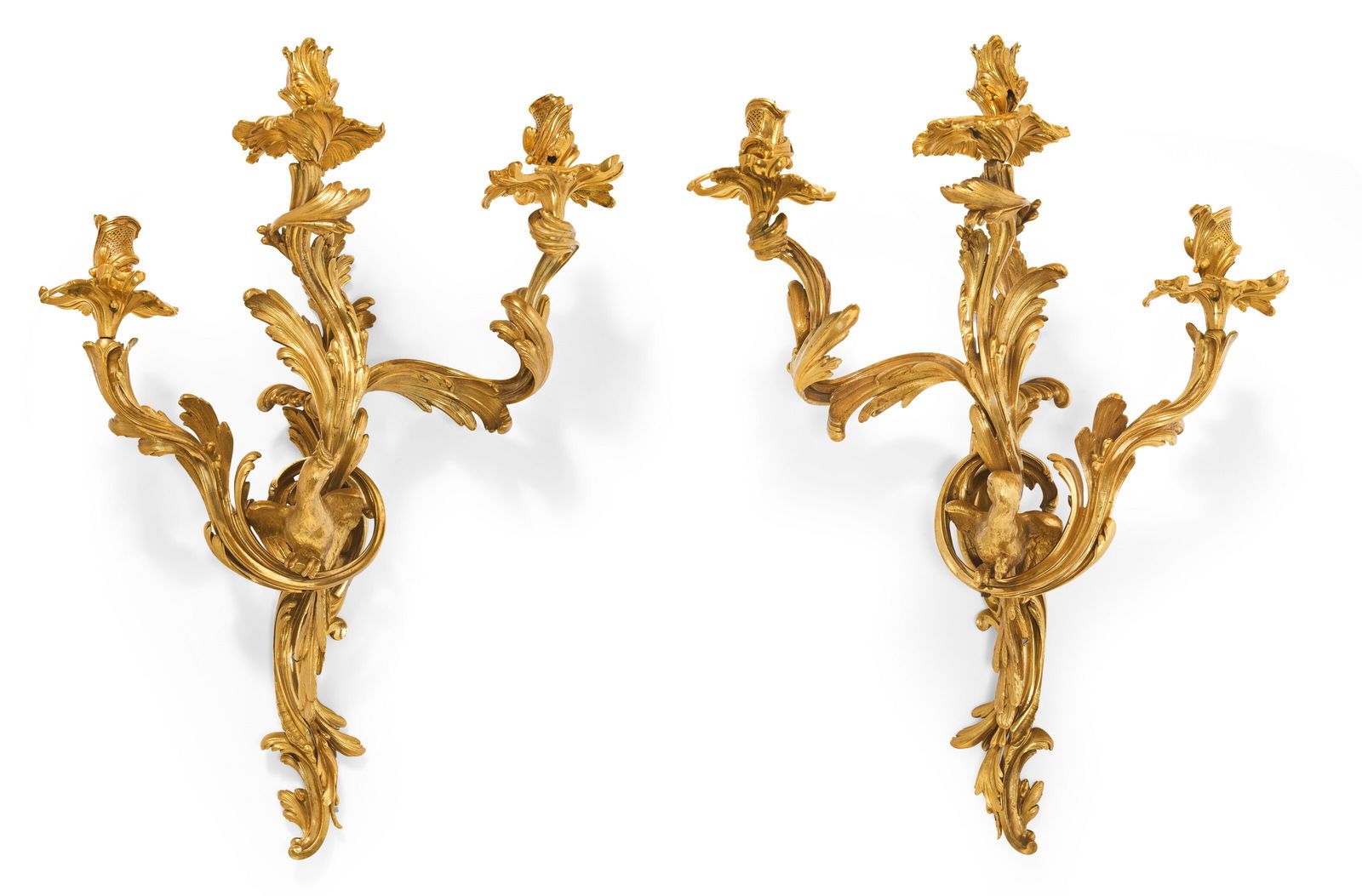 A PAIR OF FRENCH ORMOLU THREE-BRANCH WALL-LIGHTS LATE 19TH/EARLY 20TH CENTURY: A PAIR OF FRENCH ORMOLU THREE-BRANCH WALL-LIGHTS LATE 19TH/EARLY 20TH CENTURY Details A PAIR OF FRENCH ORMOLU THREE-BRANCH WALL-LIGHTS LATE 19TH/EARLY 20TH CENTURY Each with a scrolled foliate standar