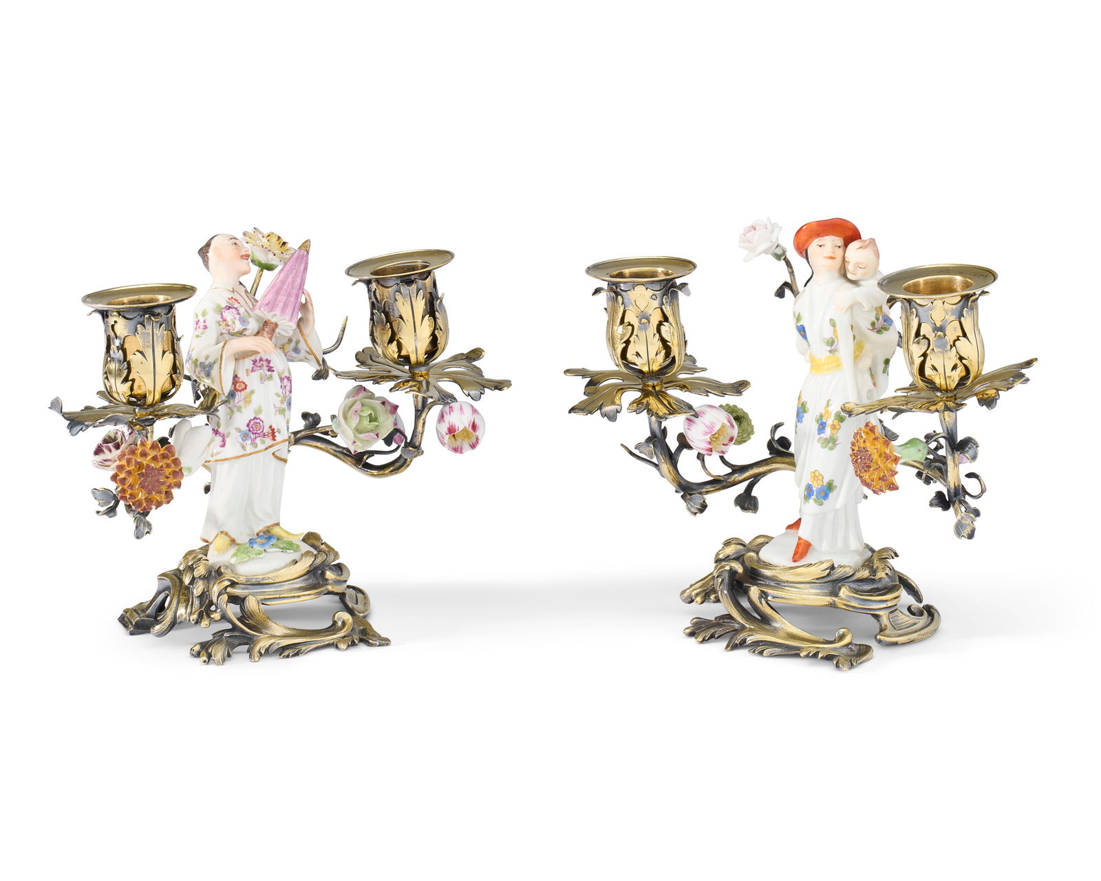 A PAIR OF SILVER-GILT AND MEISSEN PORCELAIN TWIN-BRANCH CANDELABRA THE PORCELAIN FIGURES CIRCA 1745,: A PAIR OF SILVER-GILT AND MEISSEN PORCELAIN TWIN-BRANCH CANDELABRA THE PORCELAIN FIGURES CIRCA 1745, THE FLOWERS 18TH CENTURY AND LATER, THE MOUNTS FRANCE, 19TH CENTURY Details A PAIR OF SILVER-GILT A
