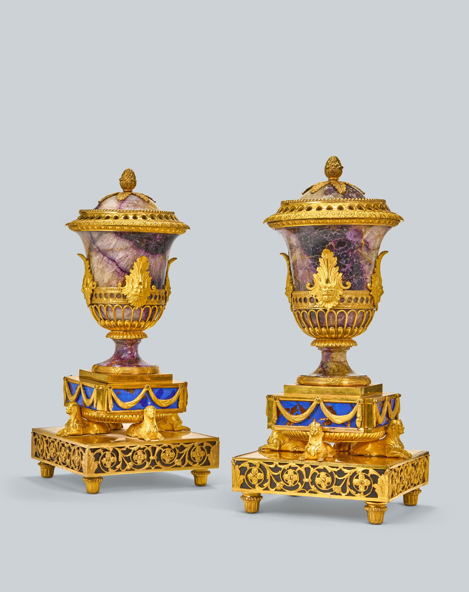 A PAIR OF GEORGE III ORMOLU-MOUNTED BLUE JOHN, SIMULATED LAPIS LAZULI AND EBONY ‘SPHINX’ (1 of 9)