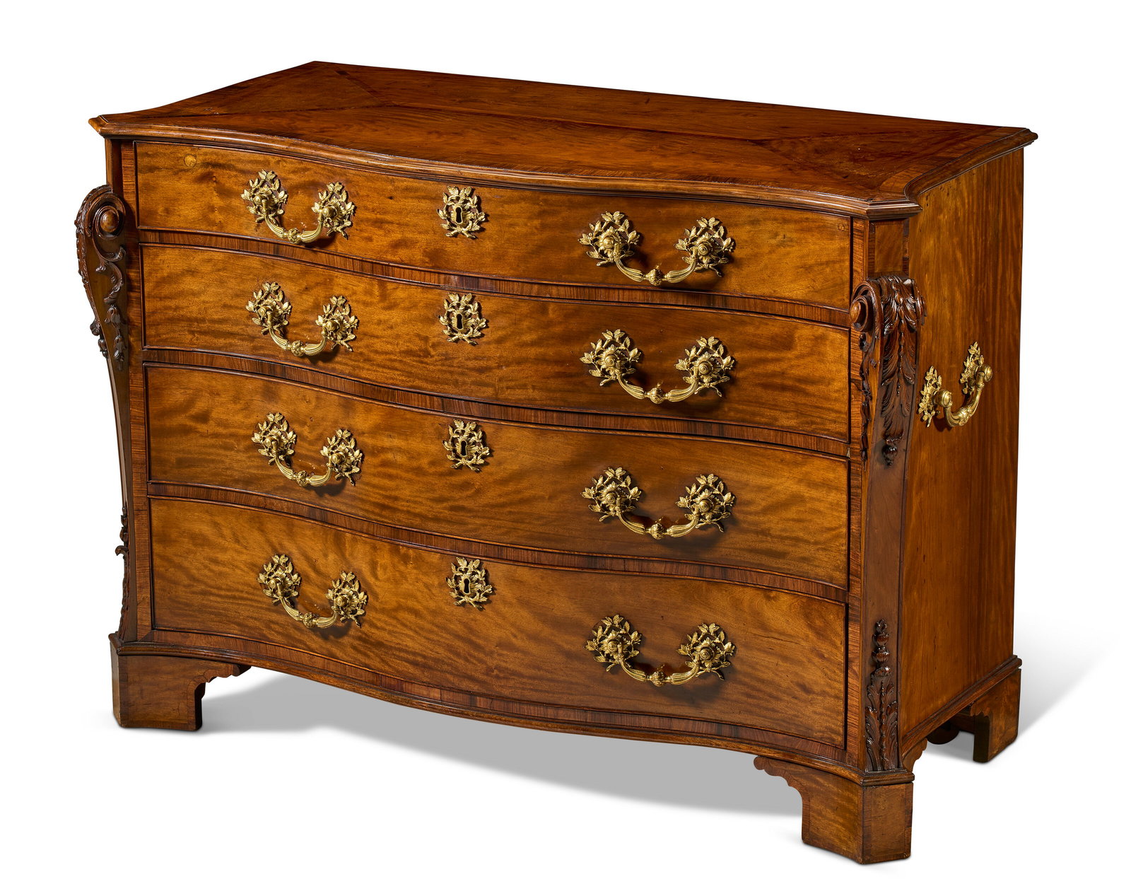 A GEORGE II INDIAN ROSEWOOD-BANDED SABICU COMMODE ATTRIBUTED TO JOHN COBB, CIRCA 1765, THE CARVING (1 of 6)