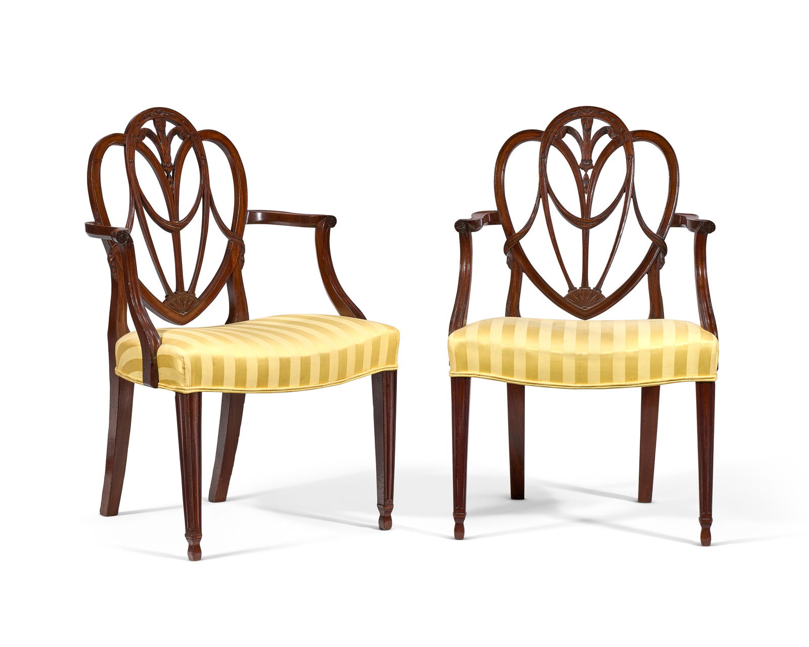 A PAIR OF GEORGE III MAHOGANY ARMCHAIRS ATTRIBUTED TO GILLOWS, CIRCA 1790 (1 of 4)
