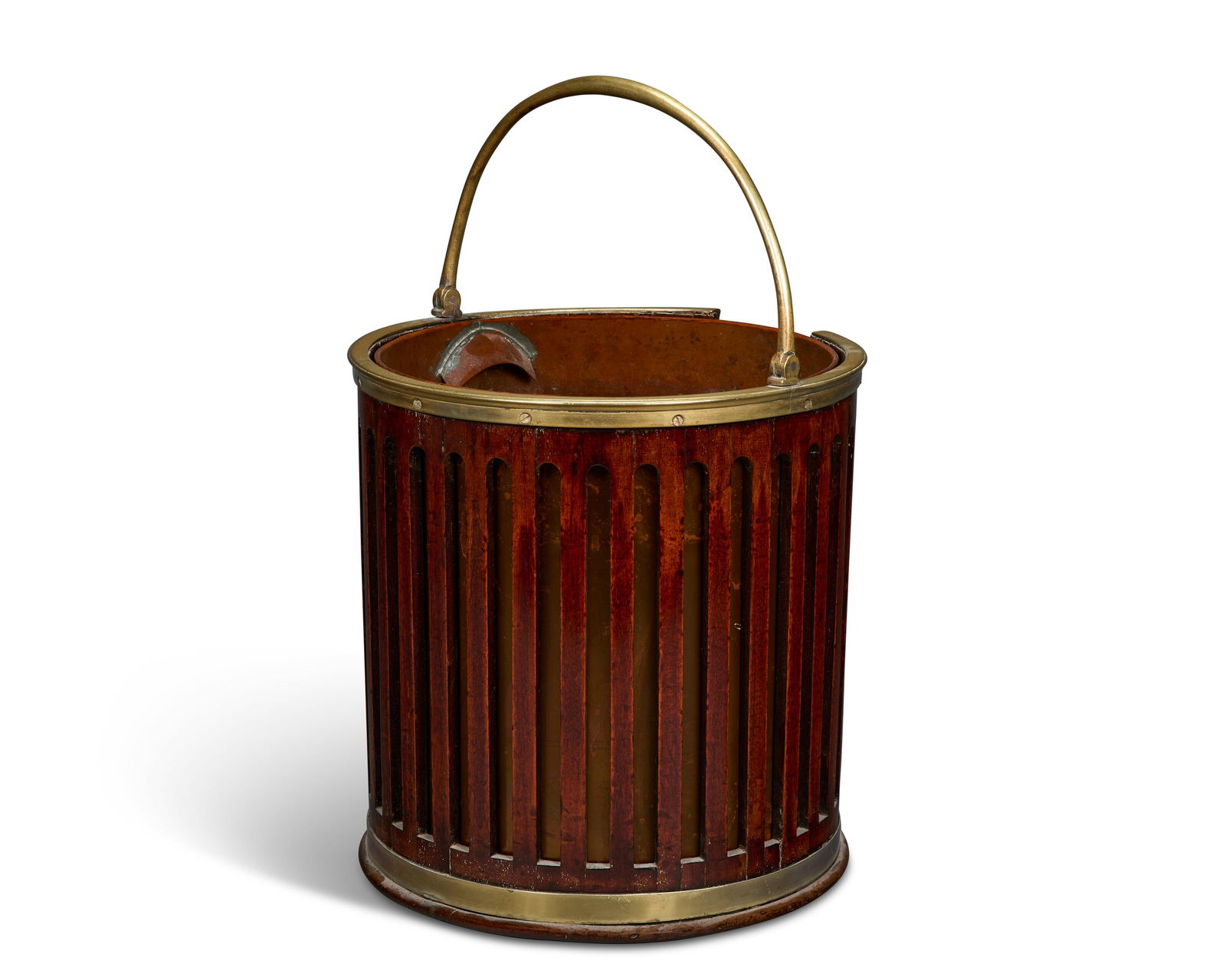 A GEORGE III BRASS-BOUND MAHOGANY PLATE BUCKET CIRCA 1800: A GEORGE III BRASS-BOUND MAHOGANY PLATE BUCKET CIRCA 1800 Details With pierced slats and lifting handle, with a later copper liner 121⁄2 in. (31.8 cm.) high, 111⁄4 in. (28.6 cm.) diameter