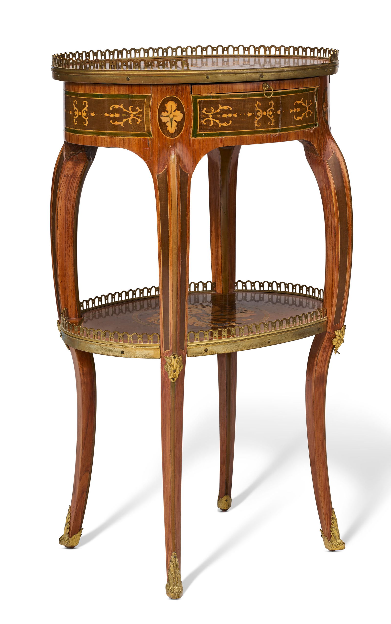 A FRENCH ORMOLU-MOUNTED TULIPWOOD, SYCAMORE AND MARQUETRY TABLE A ECRIRE THIRD QUARTER 18TH CENTURY: A FRENCH ORMOLU-MOUNTED TULIPWOOD, SYCAMORE AND MARQUETRY TABLE A ECRIRE THIRD QUARTER 18TH CENTURY AND LATER Details The galleried oval top centered by a marquetry 'Catherine Wheel' swirl, the frieze