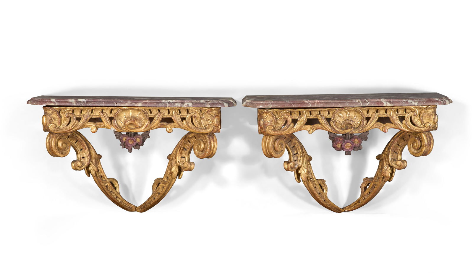 A PAIR OF LOUIS XV GILTWOOD AND POLYCHROME-DECORATED CONSOLES D'APPLIQUE POSSIBLY GERMAN, (1 of 3)