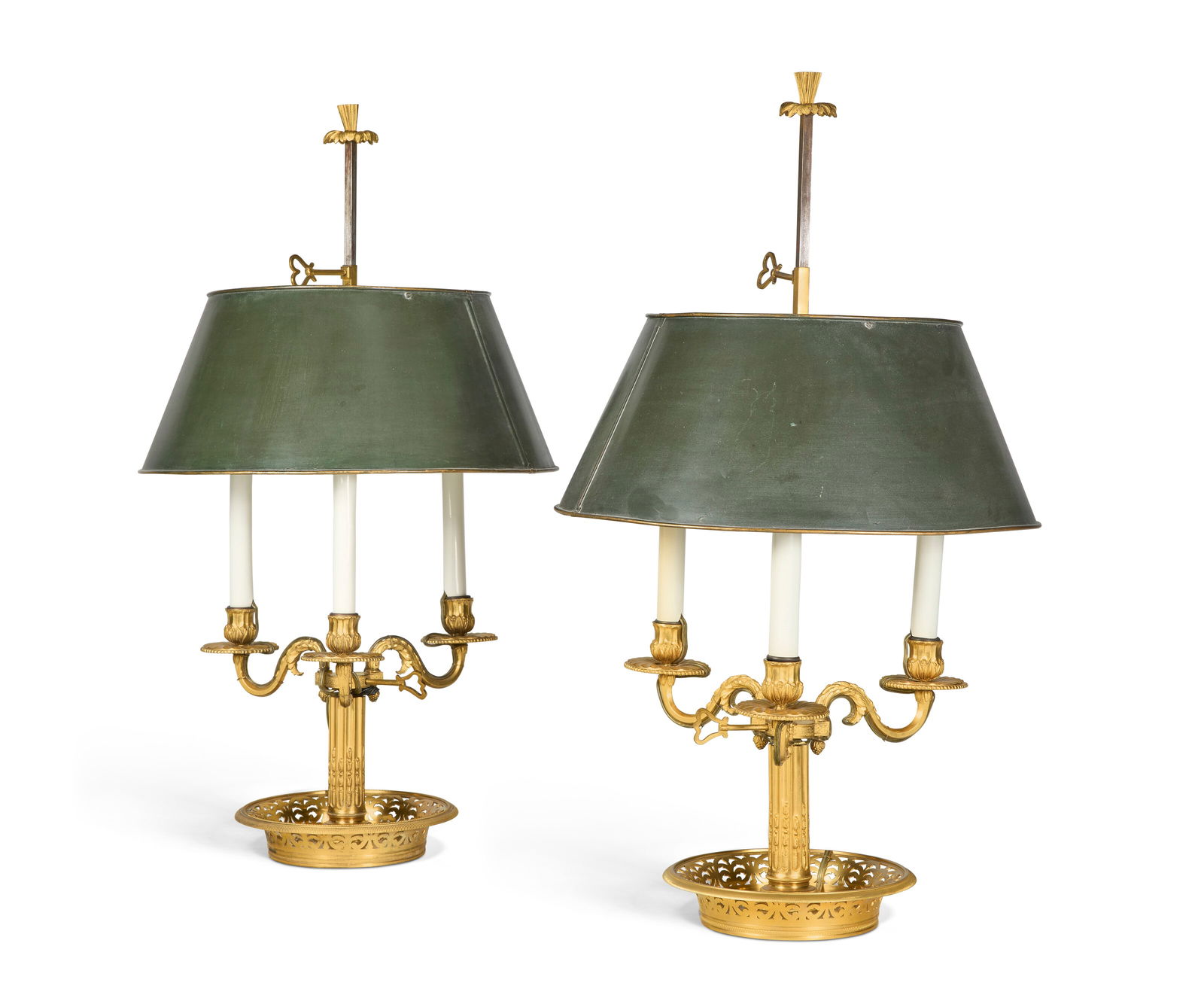 A NEAR PAIR OF LOUIS XVI-STYLE ORMOLU BOUILLOTTE LAMPS 20TH CENTURY: A NEAR PAIR OF LOUIS XVI-STYLE ORMOLU BOUILLOTTE LAMPS 20TH CENTURY Details Each adjustable green tôle peinte shade below a plume finial, the three scrolling candle-arms on a stop-fluted columnar