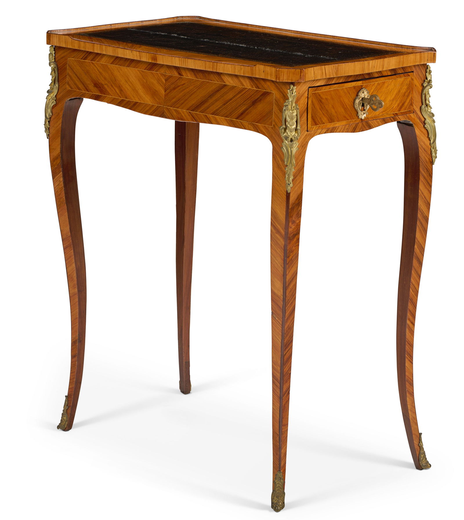 A LOUIS XV ORMOLU-MOUNTED TULIPWOOD TABLE A ECRIRE BY JACQUES DUBOIS, CIRCA 1765: A LOUIS XV ORMOLU-MOUNTED TULIPWOOD TABLE A ECRIRE BY JACQUES DUBOIS, CIRCA 1765 Details The shaped rectangular leather-lined top with a wood three-quarter gallery, with a long drawer to one side, on