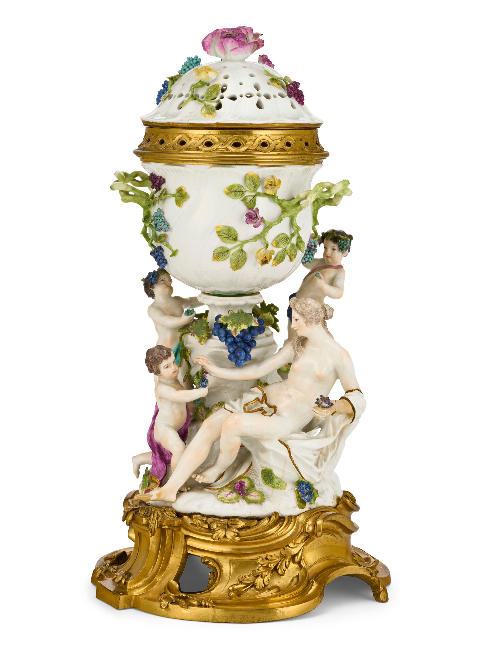 AN ORMOLU-MOUNTED MEISSEN PORCELAIN FIGURAL POT-POURRI CENTERPIECE AND COVER THE PORCELAIN MID-18TH: AN ORMOLU-MOUNTED MEISSEN PORCELAIN FIGURAL POT-POURRI CENTERPIECE AND COVER THE PORCELAIN MID-18TH CENTURY, FAINT BLUE CROSSED SWORDS MARK TO SIDE OF BASE, THE ORMOLU OF A LATER DATE Details Emblemat