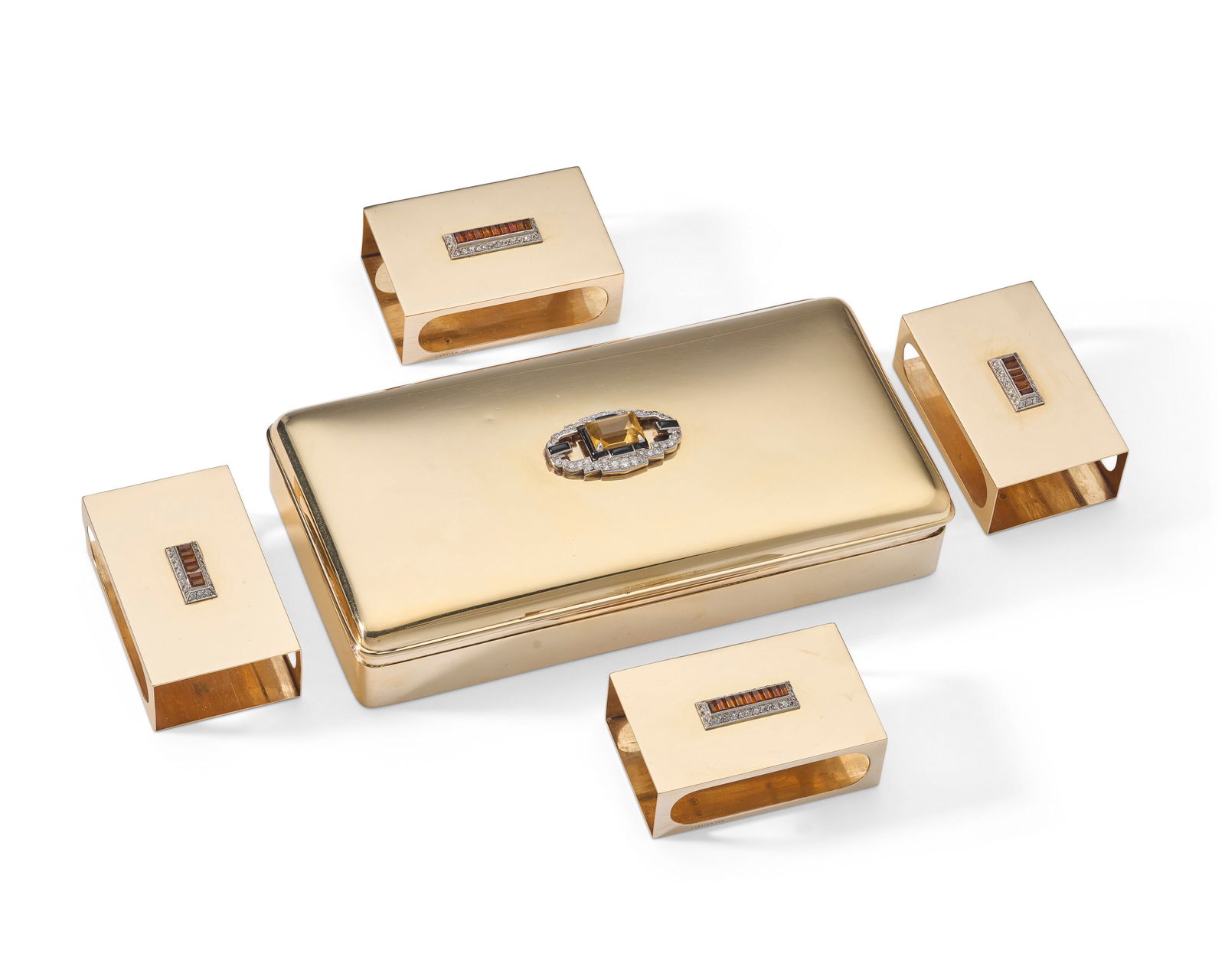 AN AMERICAN JEWELED GOLD CIGARETTE BOX AND FOUR MATCHING MATCHBOX HOLDERS MARK OF CARTIER, NEW YORK, (1 of 2)