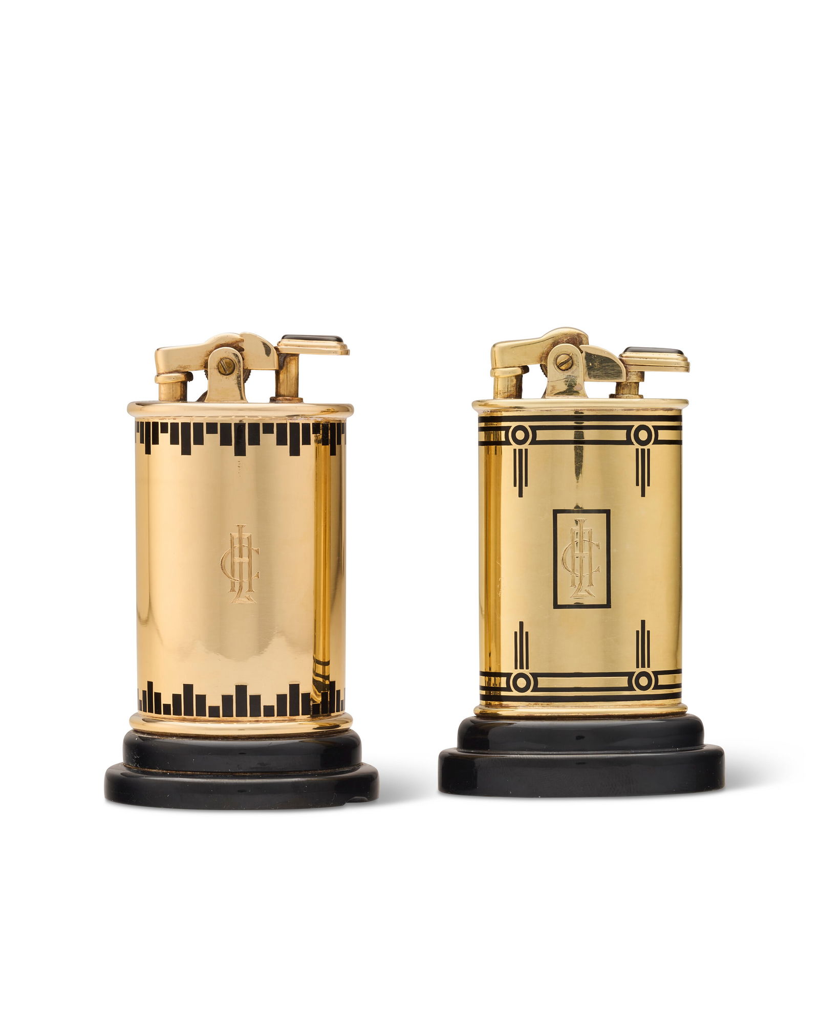 TWO SIMILAR GOLD AND ENAMEL TABLE LIGHTERS BY CARTIER, NEW YORK, CIRCA 1935 (1 of 1)