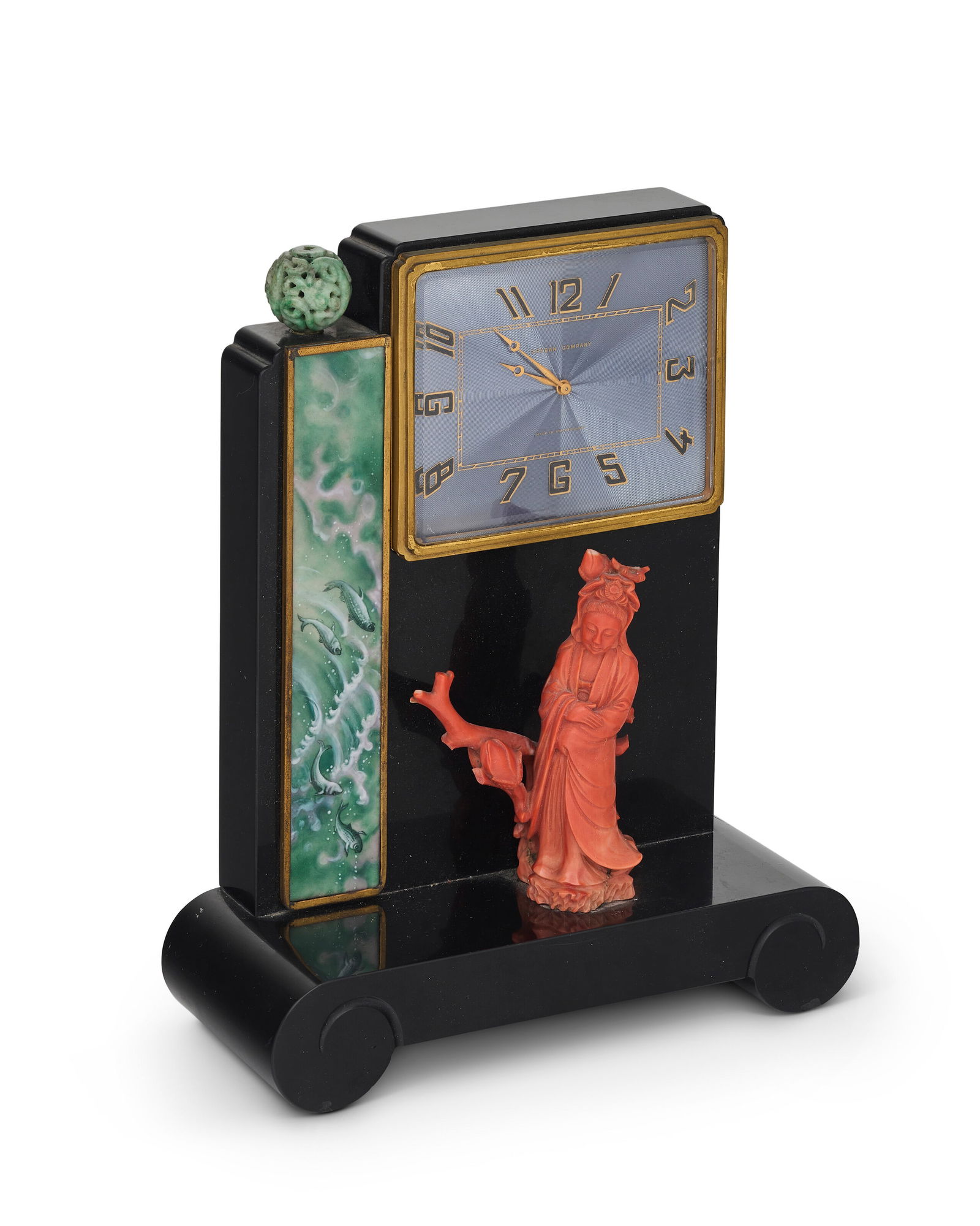 AN AMERICAN ART DECO TABLE CLOCK BY GROGAN COMPANY, PITTSBURGH, PENNSYLVANIA, CIRCA 1930: AN AMERICAN ART DECO TABLE CLOCK BY GROGAN COMPANY, PITTSBURGH, PENNSYLVANIA, CIRCA 1930 Details Of manual movement, in the Chinoiserie taste, on a scrolled rectangular base mounted with a coral Guany