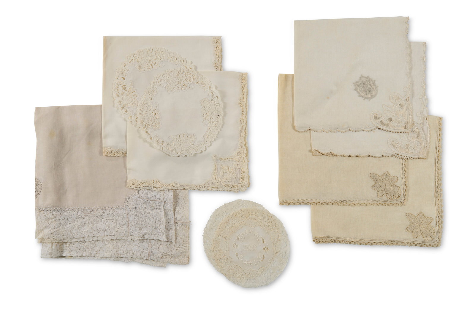A GROUP OF VARIOUS SETS OF NAPKINS 20TH CENTURY: A GROUP OF VARIOUS SETS OF NAPKINS 20TH CENTURY Details Comprising four styles of dinner napkins with lace trim, two with monogram 'MWS', two without, two styles of linen cocktail napkins with lace bo