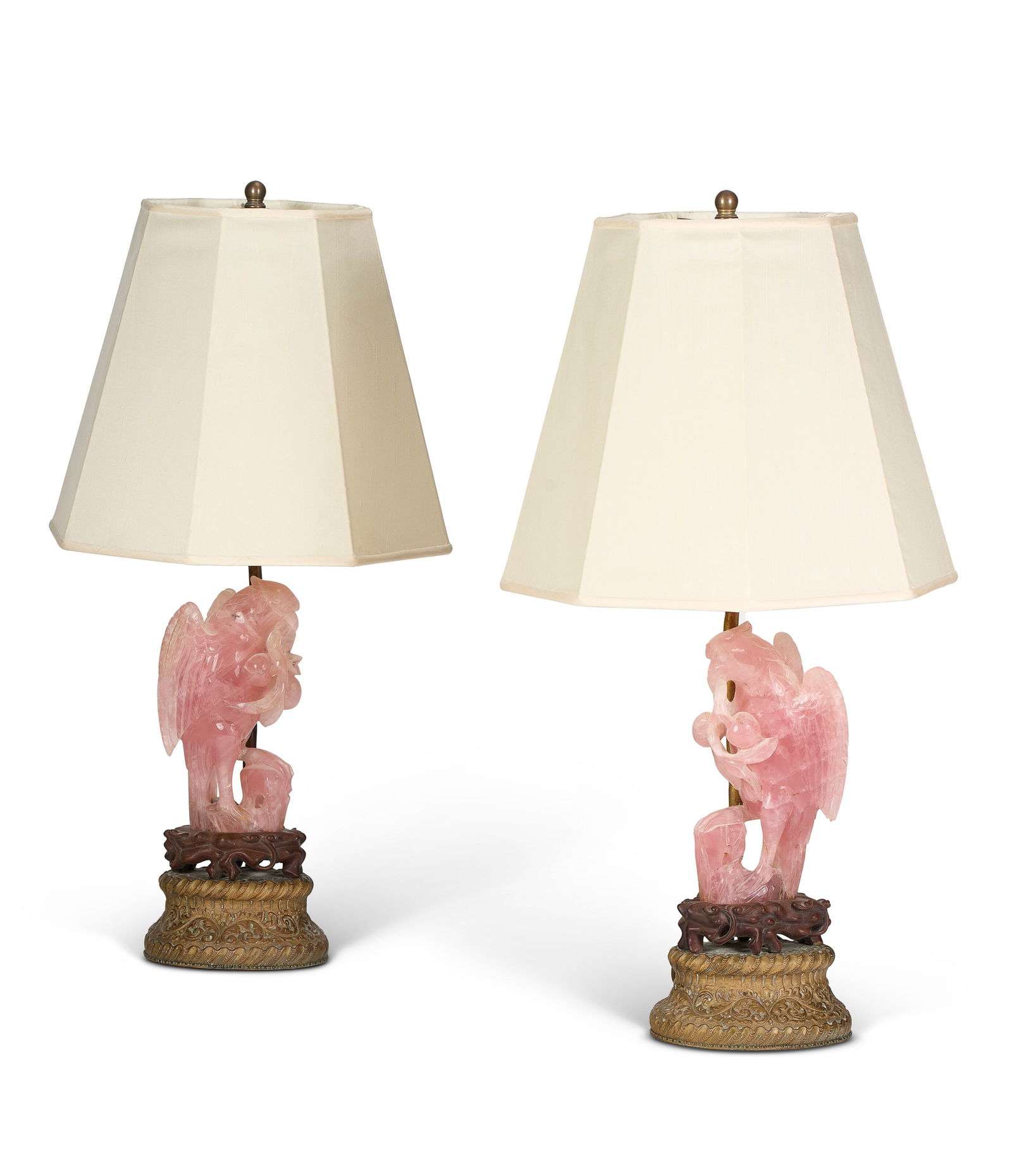 A PAIR OF CHINESE ROSE QUARTZ CARVINGS OF PARROTS 20TH CENTURY: A PAIR OF CHINESE ROSE QUARTZ CARVINGS OF PARROTS 20TH CENTURY Details Each: 7 in. (17.8 cm.) high, teak stands Provenance Annie Laurie Crawford, later Aitken (1900-1984), acquired in the 1930s.