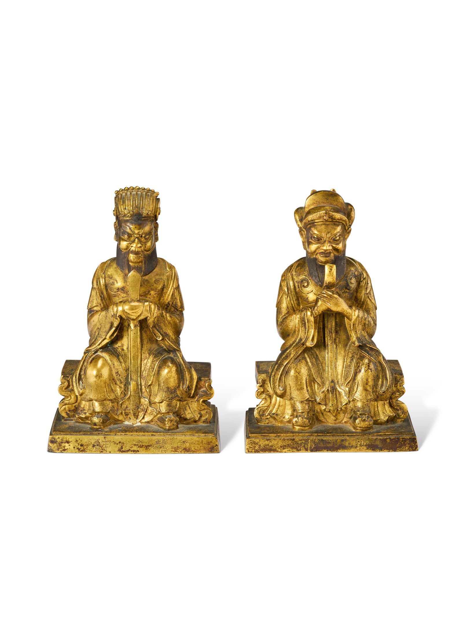 TWO CHINESE GILT-BRONZE FIGURES OF SEATED DAOIST DEITIES 17TH-18TH CENTURY: TWO CHINESE GILT-BRONZE FIGURES OF SEATED DAOIST DEITIES 17TH-18TH CENTURY Details The larger: 6 3/4 in. (17.1 cm.) high Provenance Mr. and Mrs. John D. Rockefeller 3rd, New York By descent from the a
