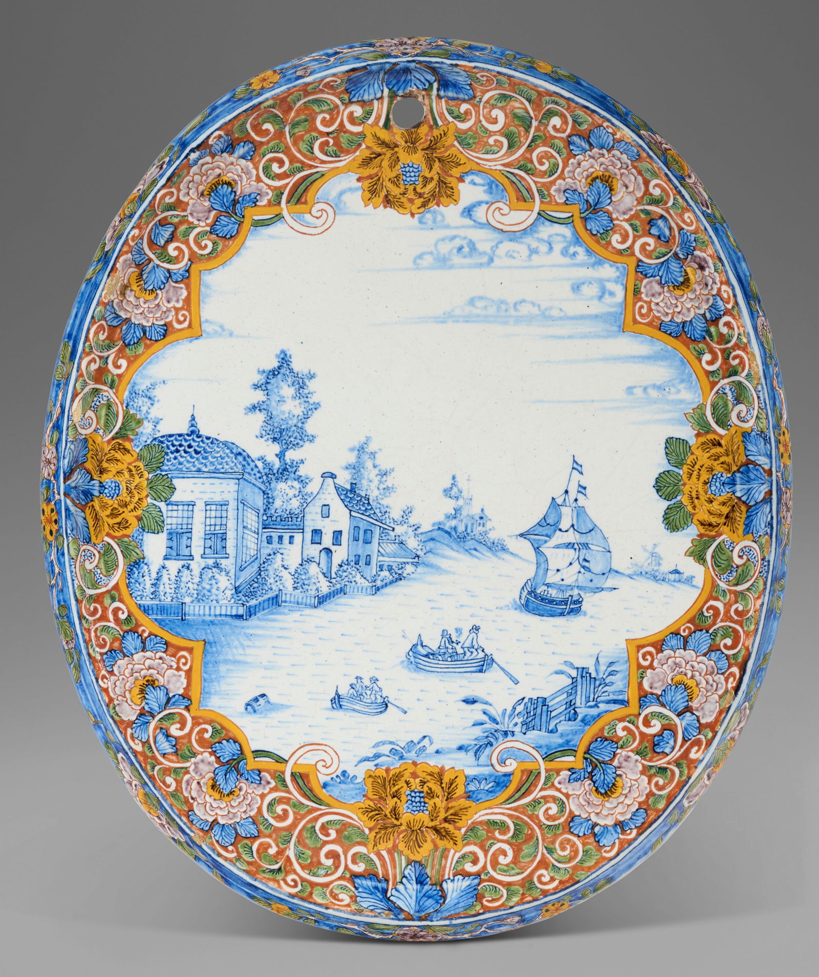 A DUTCH DELFT POLYCHROME OVAL PLAQUE CIRCA 1740-1760 (1 of 2)