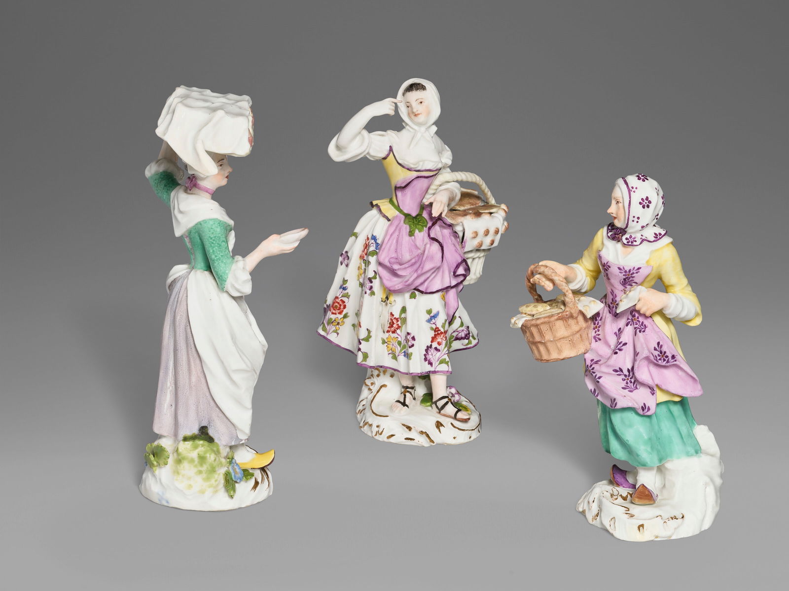 THREE MEISSEN PORCELAIN FEMALE 'CRIS DE PARIS' FIGURES CIRCA 1755, SMALL BLUE CROSSED SWORDS TO THE (1 of 5)