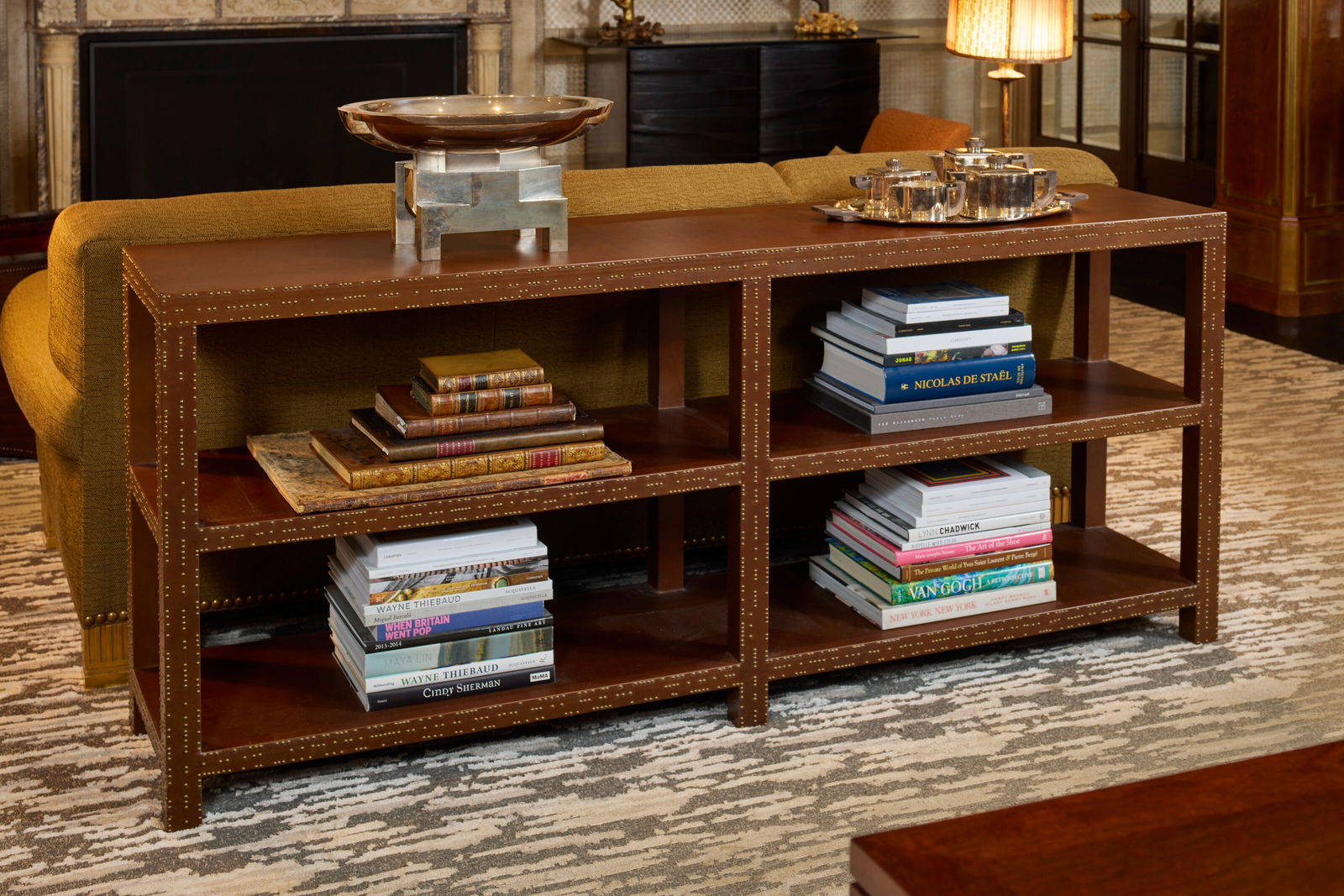 PETER MARINO (B. 1949) Tiered Shelf: PETER MARINO (B. 1949) Tiered Shelf Details leather-bound wood, brass 32 x 76 x 16 in. (81.2 x 193 x 40.7 cm) Provenance Supplied by Peter Marino Architect